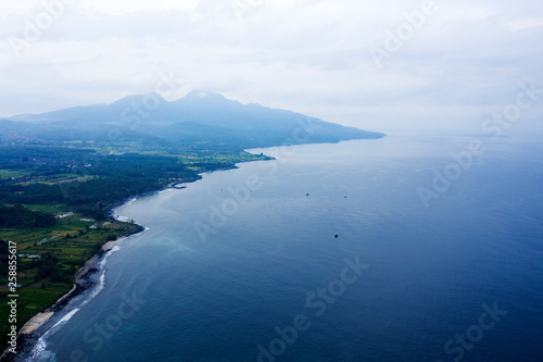 Aerial view of White Sand Virgin Beach, blue sea, coastline and mountain. Bali, Indonesia.