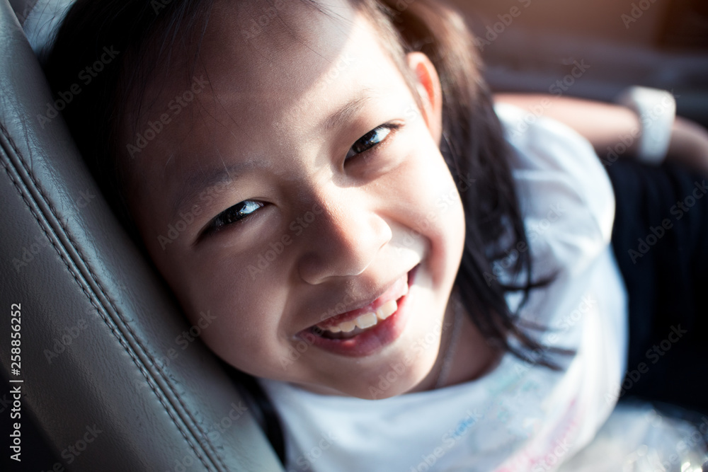 Portrait of asian little girl smiling in the car Portrait of asian little girl smiling in the car