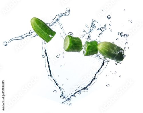 Sliced cucumber with splashing water or explosion flying in the air isolated on white background