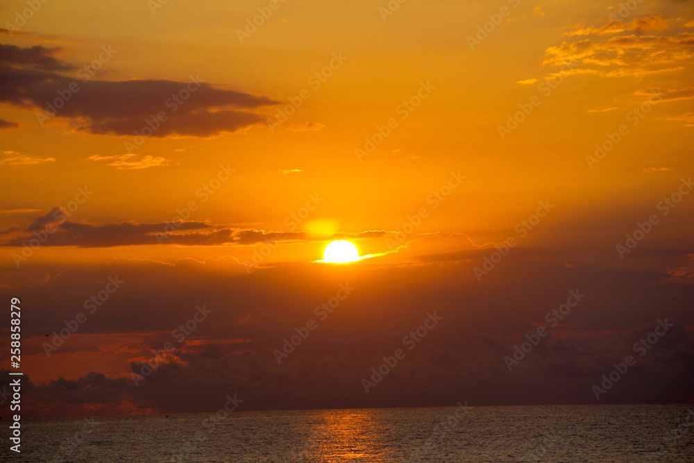 Dramatic sunrise by the sea