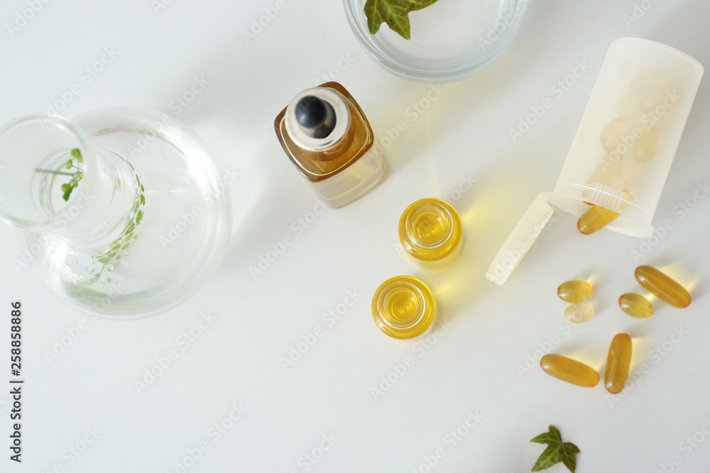 Remedies with natural herbal extract on white table Remedies with natural herbal extract on white table