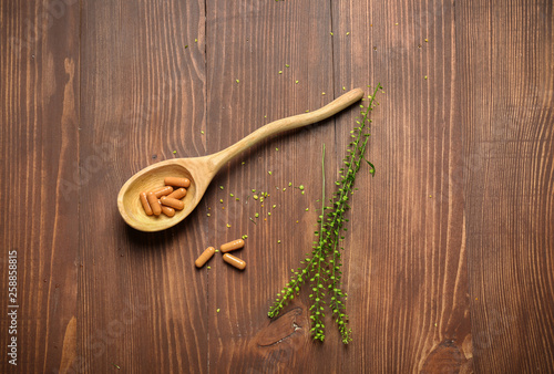 Herbal Capsules and Spoon o...