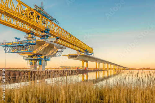 Construction site of Crown Princess Mary bridge in the sunset photo