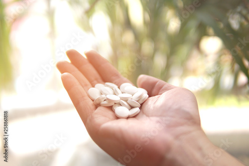Group of Medicine pills in the hand.