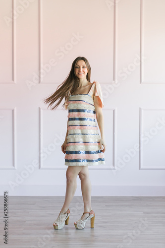 Wallpaper Mural Fashionable woman in a colorful stripes dress posing in a studio. Torontodigital.ca