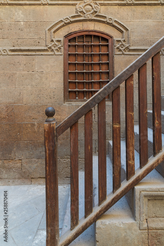 Wooden window and staircase with wooden balustrade leading to historic Beit El Set Waseela building (Waseela Hanem House), Old Cairo, Egypt photo
