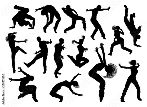 A set of men and women street dance hip hop dancers in silhouette