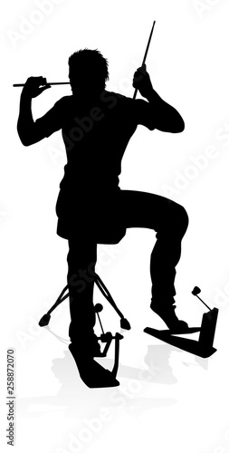 A drummer musician drumming drums in detailed silhouette