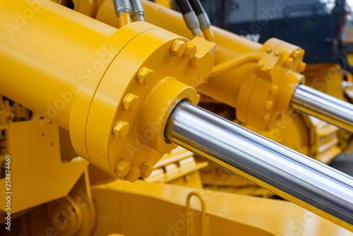 Powerful hydraulic cylinders. The main power and driving element for construction equipment photo