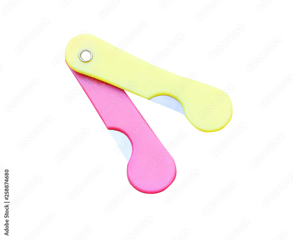 Colorful yellow and pink folding knife isolated on white background with clipping path , off Colorful yellow and pink folding knife isolated on white background with clipping path , off