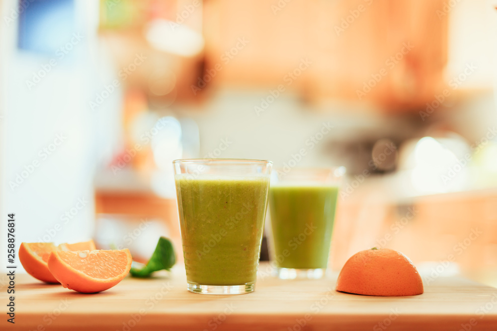 Good morning: Fresh green smoothies and fruits in the kitchen, healthy breakfast Good morning: Fresh green smoothies and fruits in the kitchen, healthy breakfast