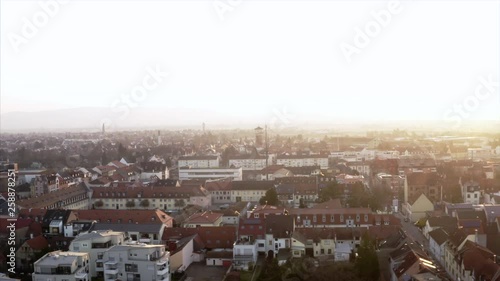 Schwetzingen in morning light. The camera pans over the roofs of the city. Small and big streets are painted in golden light by the sun. An athmospheric view over the touristic magnet in Baden-Würthem photo