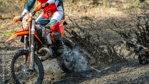 Fototapeta Naklejka Na Ścianę i Meble -  Motocross rider in the mud