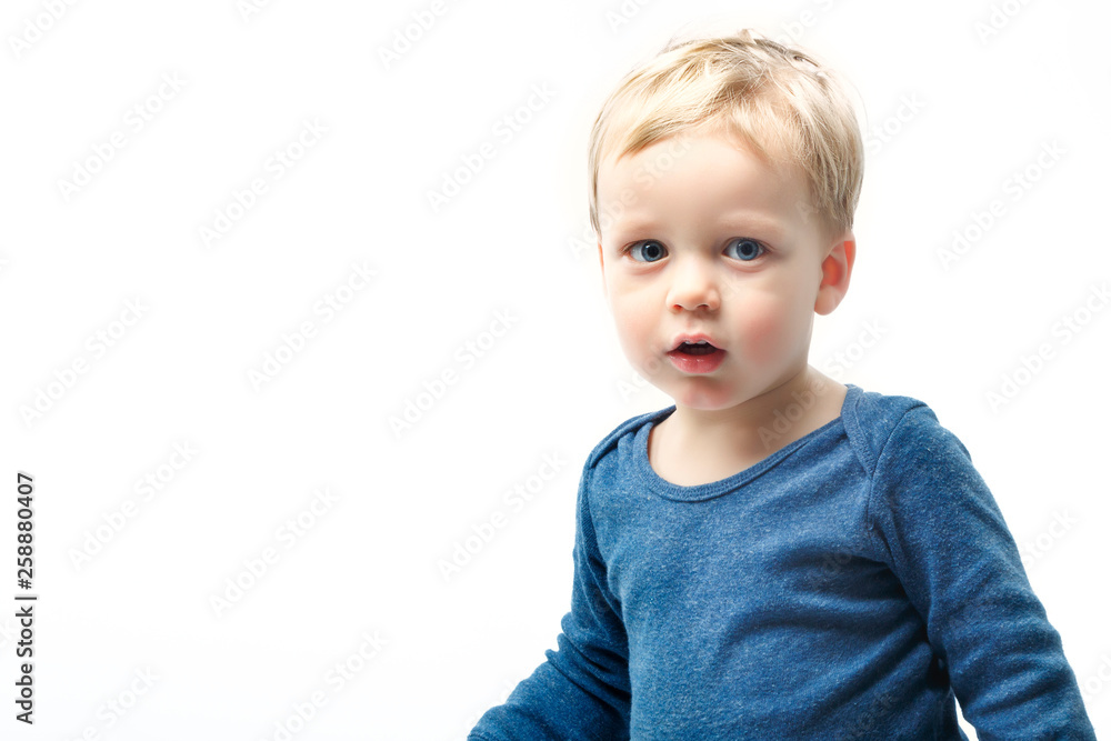 A very cute young surprised boy looking at camera, Isolated on white. A very cute young surprised boy looking at camera, Isolated on white.