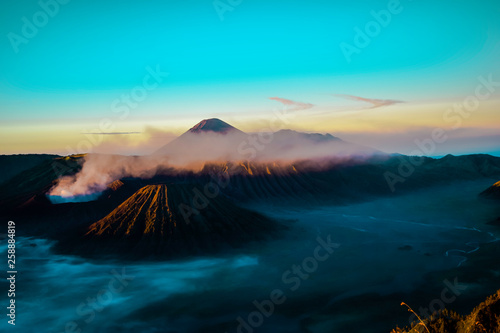 Beautiful colorful sunrise over Mount Bromo and wild island in Mount Bromo National Park © syahrir