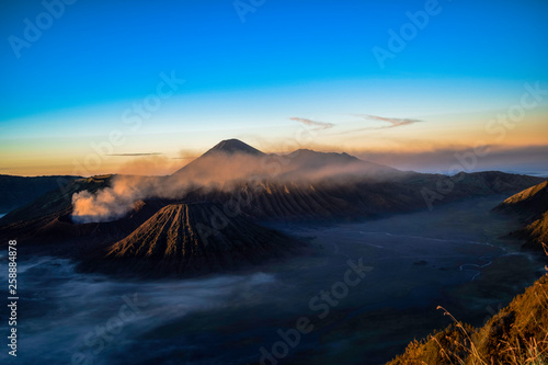 Beautiful colorful sunrise over Mount Bromo and wild island in Mount Bromo National Park © syahrir
