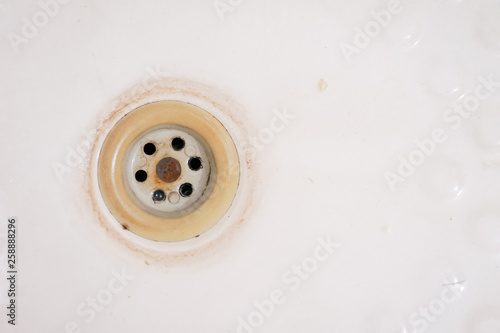 Bathroom bathtub drain sink hole old with copyspace