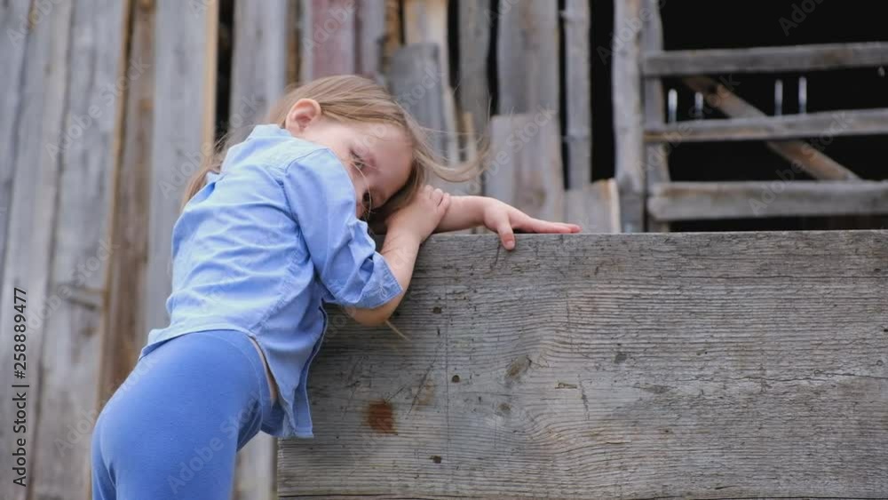 Pensive sad little girl in stylish clothes Pensive sad little girl in stylish clothes