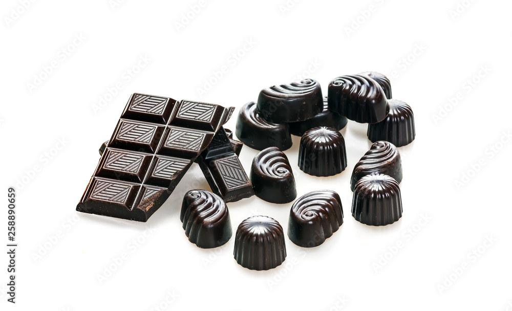 Candy and broken bar chunks of dark chocolate Candy and broken bar chunks of dark chocolate