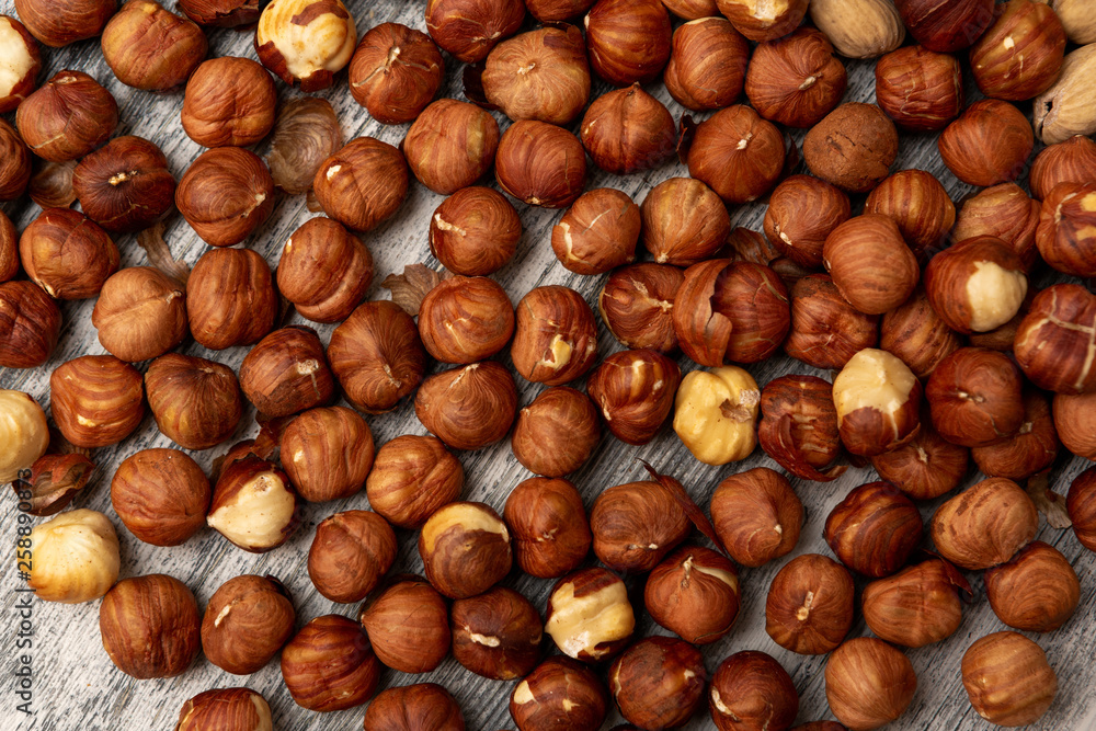 Hazelnut Background. Heap of peeled hazelnuts Hazelnut Background. Heap of peeled hazelnuts