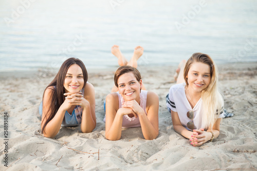 Three beautiful girlfriends at the beach © bokan