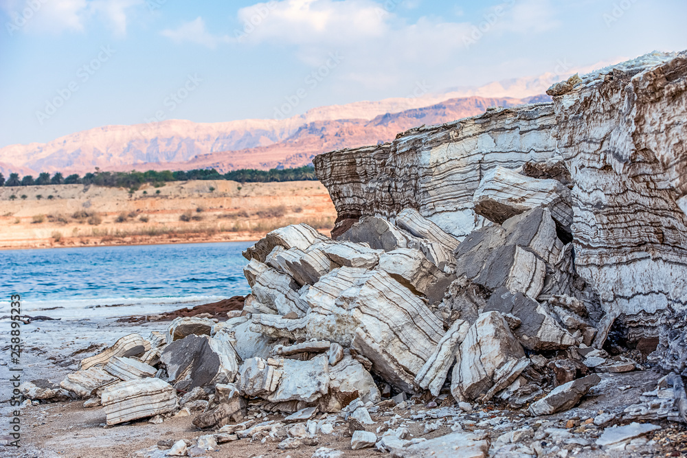 clay shores of the dead sea. The medical clay is layers and is washed with salty water