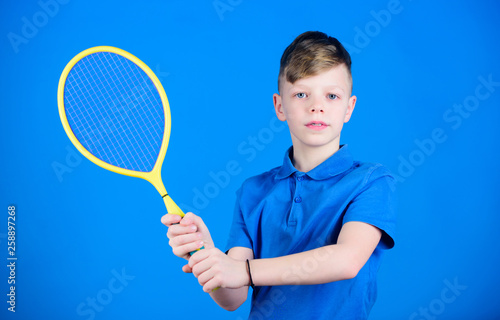 Tennis club. Tennis player with racket. Childhood activity. Little boy. Fitness diet brings health and energy. Gym workout of teen boy. Sport game success. Happy child play tennis. Tennis training