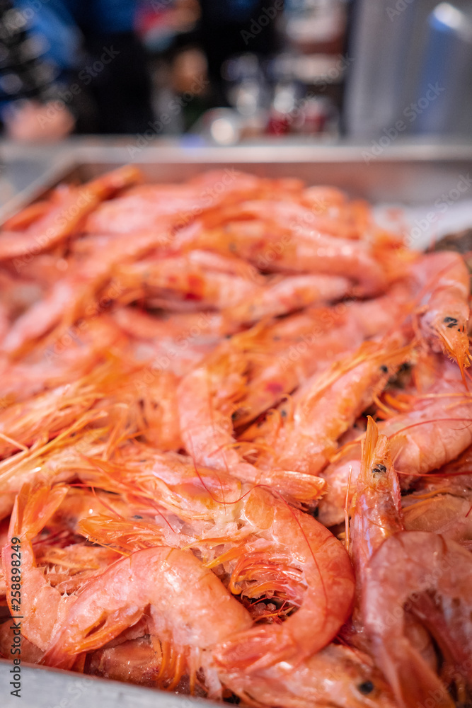 Frozen shrimps on the showcase. Selective focus.