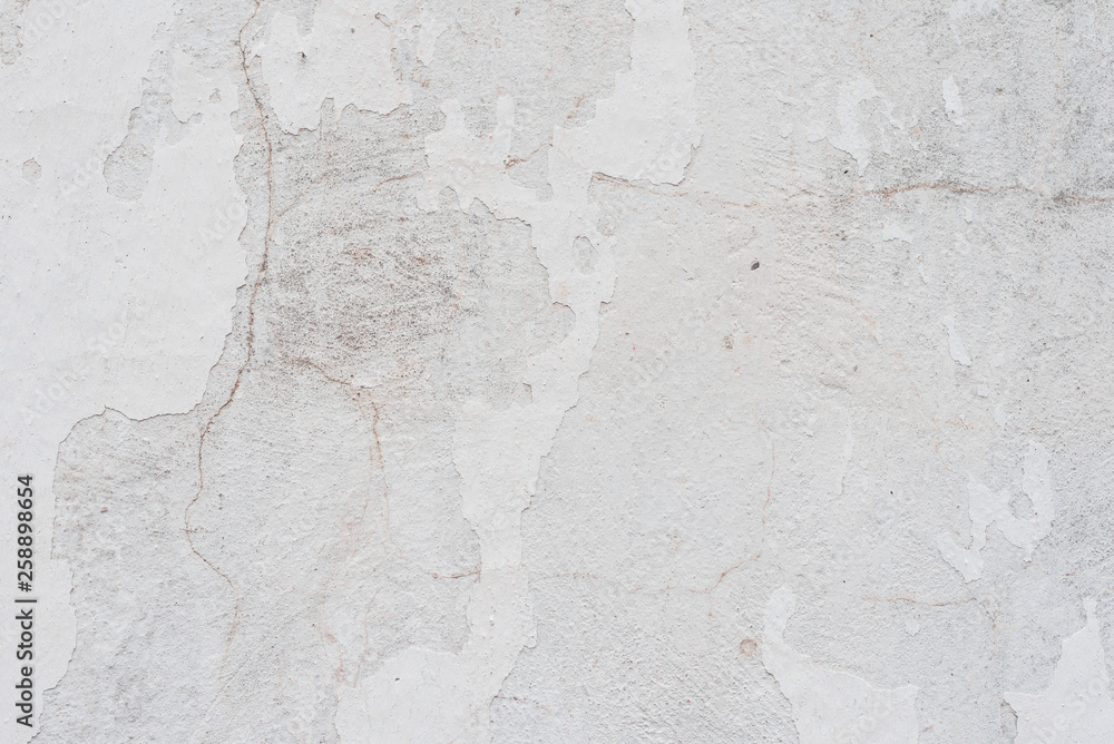 Fototapeta premium Wall fragment with scratches and cracks