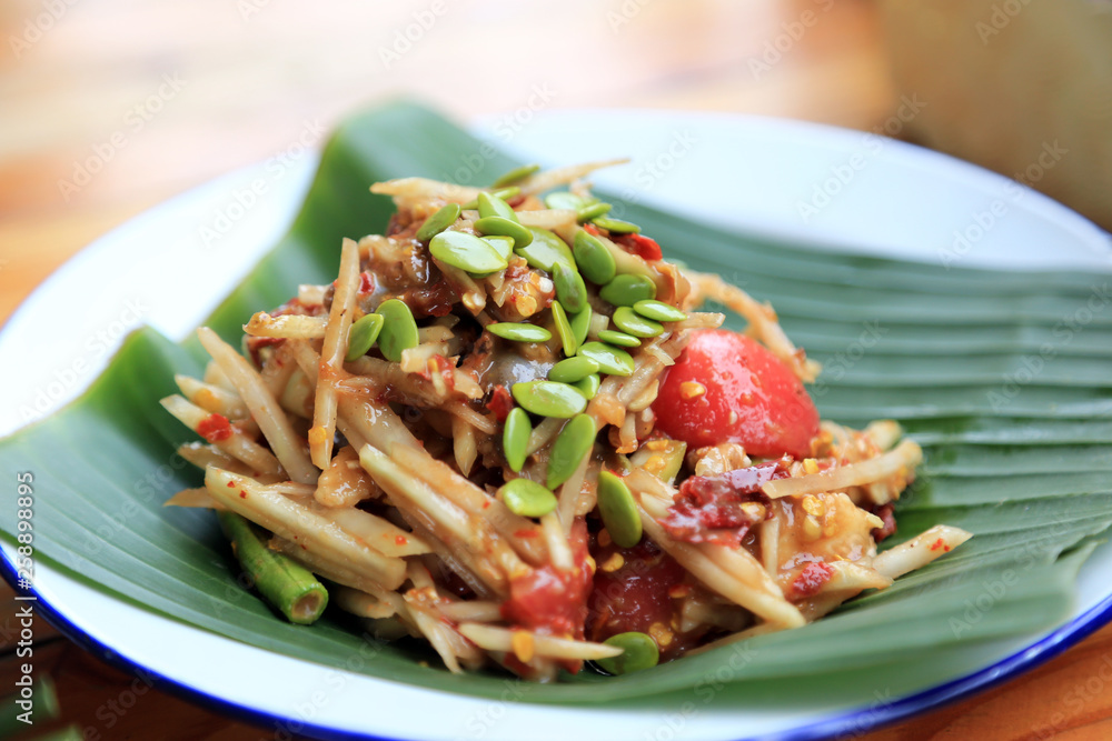 Thai spicy papaya salad “Som Tum” with white popinac seeds. Thai spicy papaya salad “Som Tum” with white popinac seeds.
