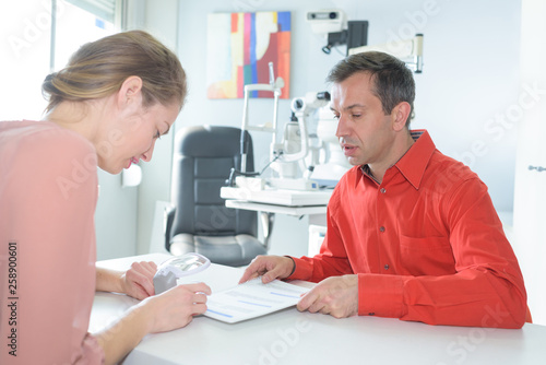 ophthalmologist with patient