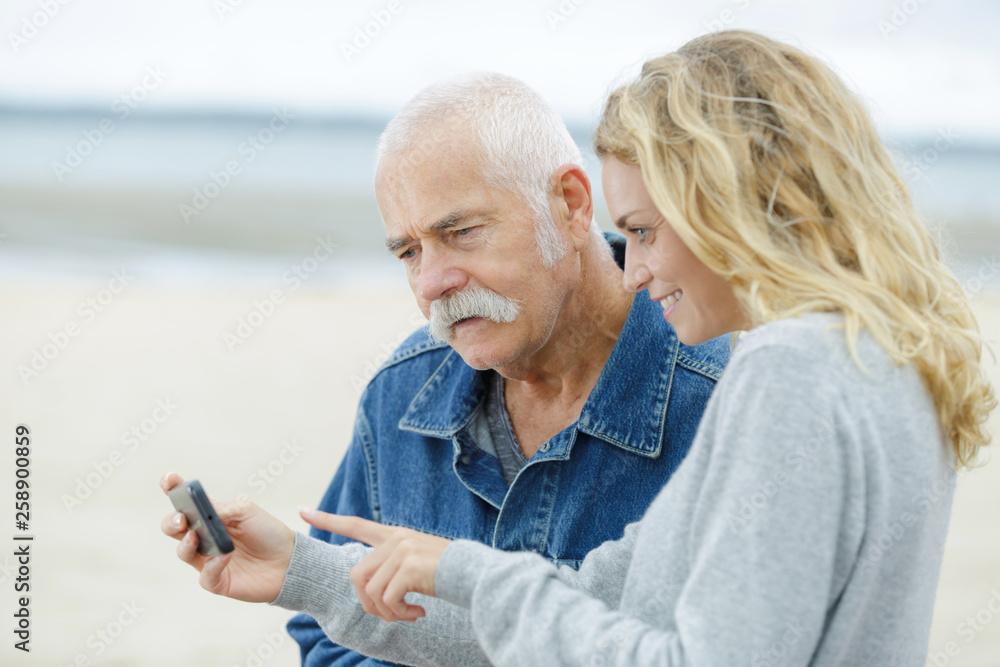 cheerful father and daughter on a beach cheerful father and daughter on a beach