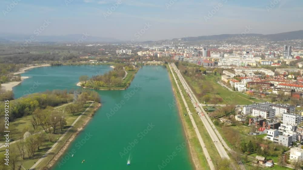 Zagreb, Croatia, Jarun lake, beautiful green recreation park area, sunny spring day, panoramic view from drone, city in background Zagreb, Croatia, Jarun lake, beautiful green recreation park area, sunny spring day, panoramic view from drone, city in background