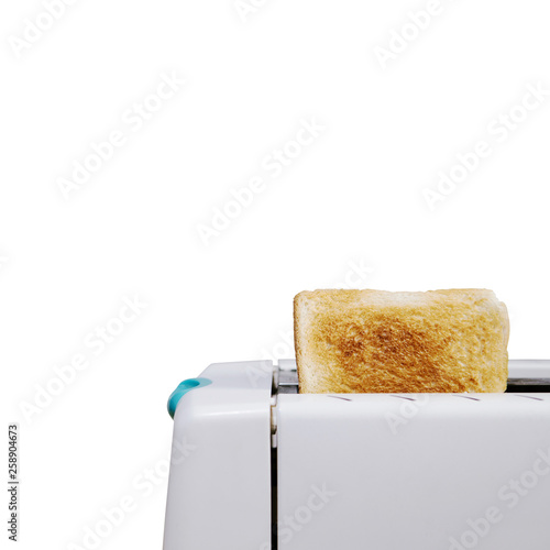 A piece of white bread toasted in the white toaster with clipping path and isolated on white background. breakfast concept.