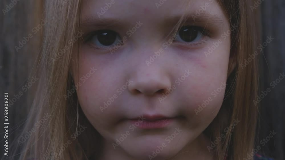 Close-up portrait of beautiful little girl worrying and nervous about something