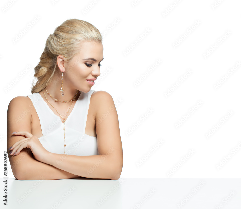 Glamorous woman sitting on white table isolated on white background Glamorous woman sitting on white table isolated on white background