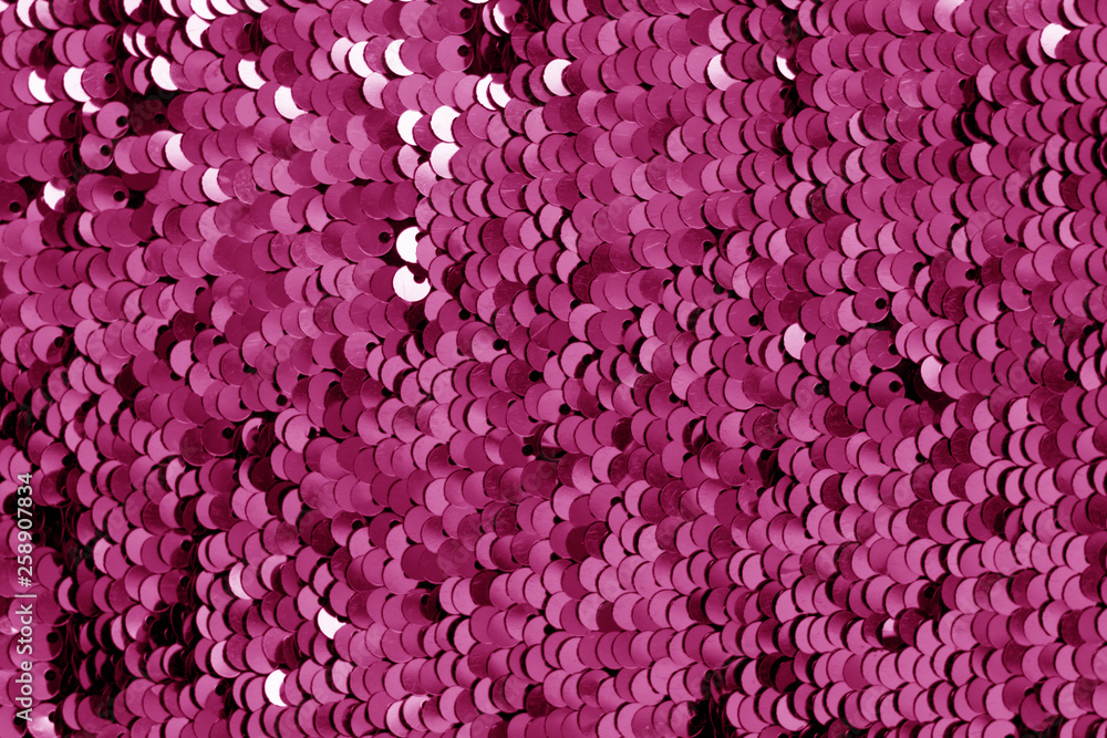 Glittering sequin texture in pink tone.