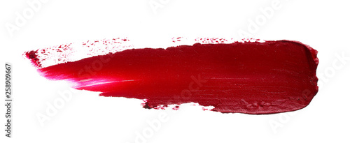 Red lipstick or acrylic paint isolated on white