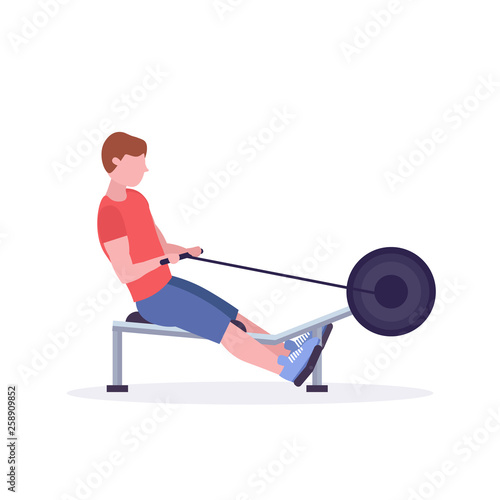 sports man doing exercises on rowing machine guy working out in gym on training apparatus crossfit healthy lifestyle concept flat white background