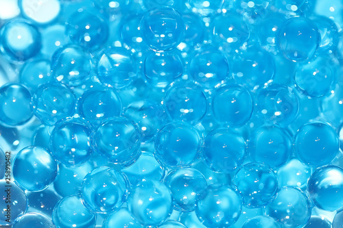 Water blue gel balls. Polymer gel. Silica gel. Balls of blue hydrogel. Crystal liquid ball with reflection. Texture background. Close up macro