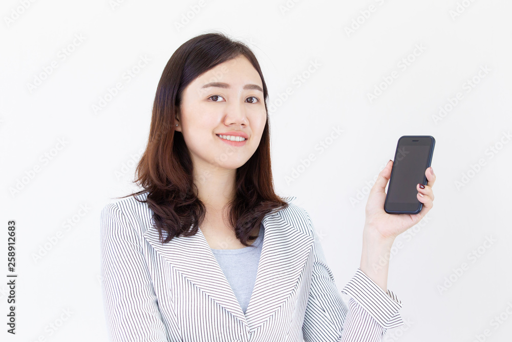 Beautiful Asian businesswomen holding a smartphone close up. Businesswomen and smartphone technology concept. Portrait on white background. Beautiful Asian businesswomen holding a smartphone close up. Businesswomen and smartphone technology concept. Portrait on white background.
