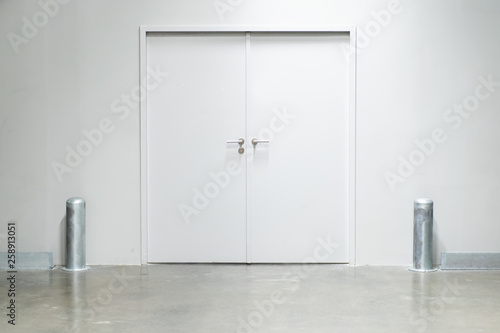 Double doors with security lock  in warehouse close up.