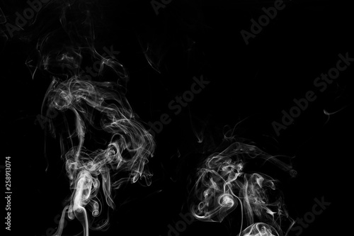 Fototapeta Naklejka Na Ścianę i Meble -  white smoke flame on a black background