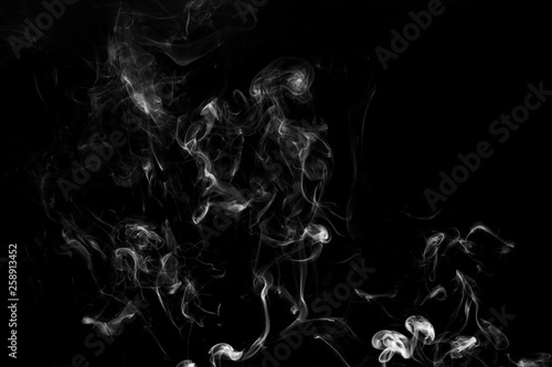 white smoke flame on a black background