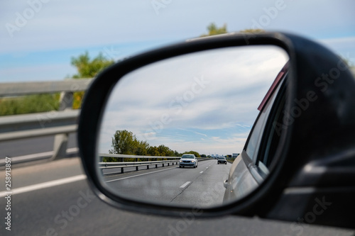 look in the rear view mirror of a car © evgenius1985