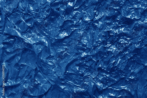 Metal foil texture in navy blue color.
