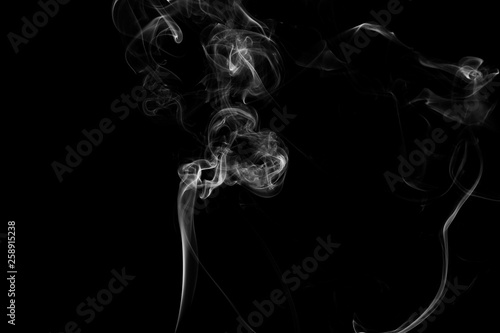 white smoke flame on a black background