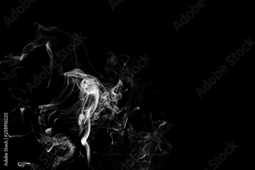 white smoke flame on a black background