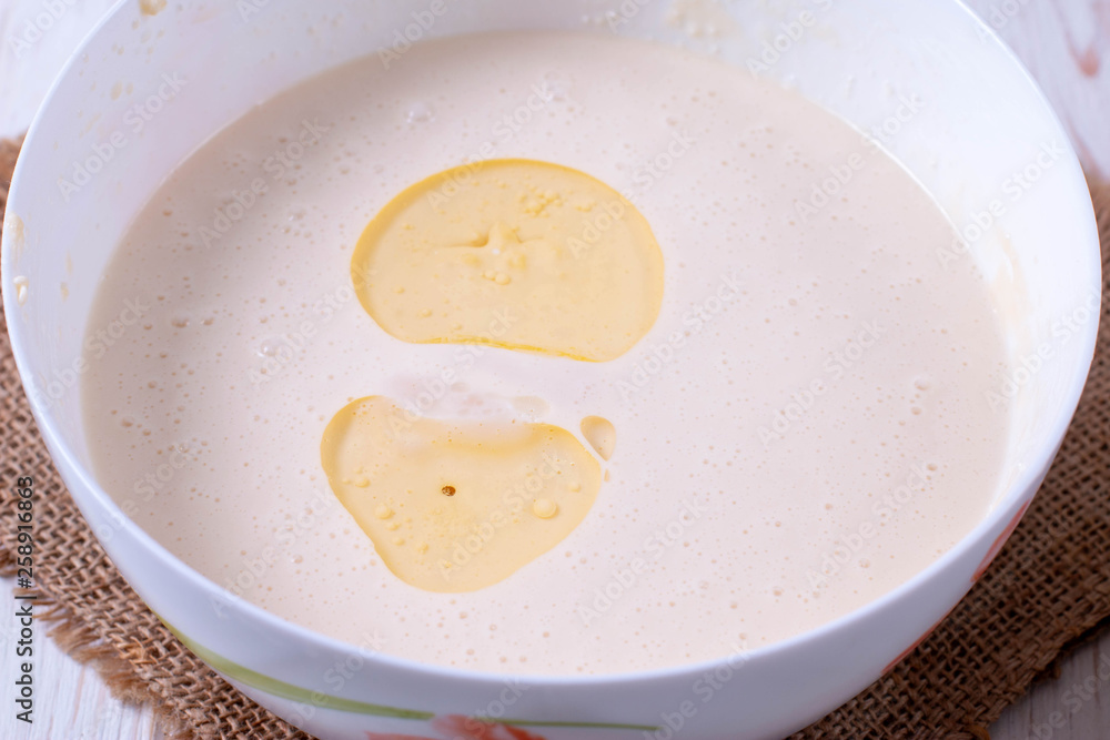 Making dough for baking pancakes Making dough for baking pancakes