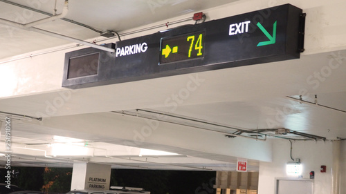 Digital parking signs with showed available space by yellow color.